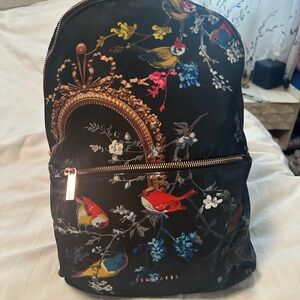 Ted Baker Black Backpack with Colorful Bird and Floral Design